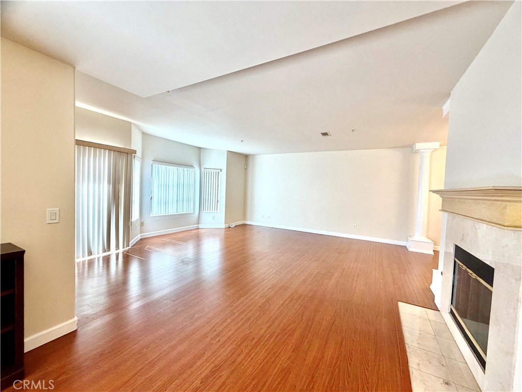 631-ave Fairview, Unit A Arcadia, CA 91006 - Photo 7 of 14 a view of an empty room with wooden floor and a window