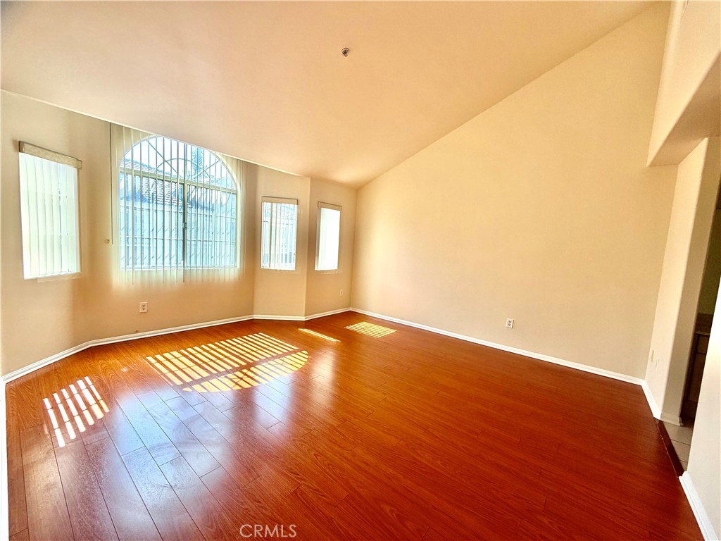 631-ave Fairview, Unit A Arcadia, CA 91006 - Photo 9 of 14 wooden floor in an empty room with a window