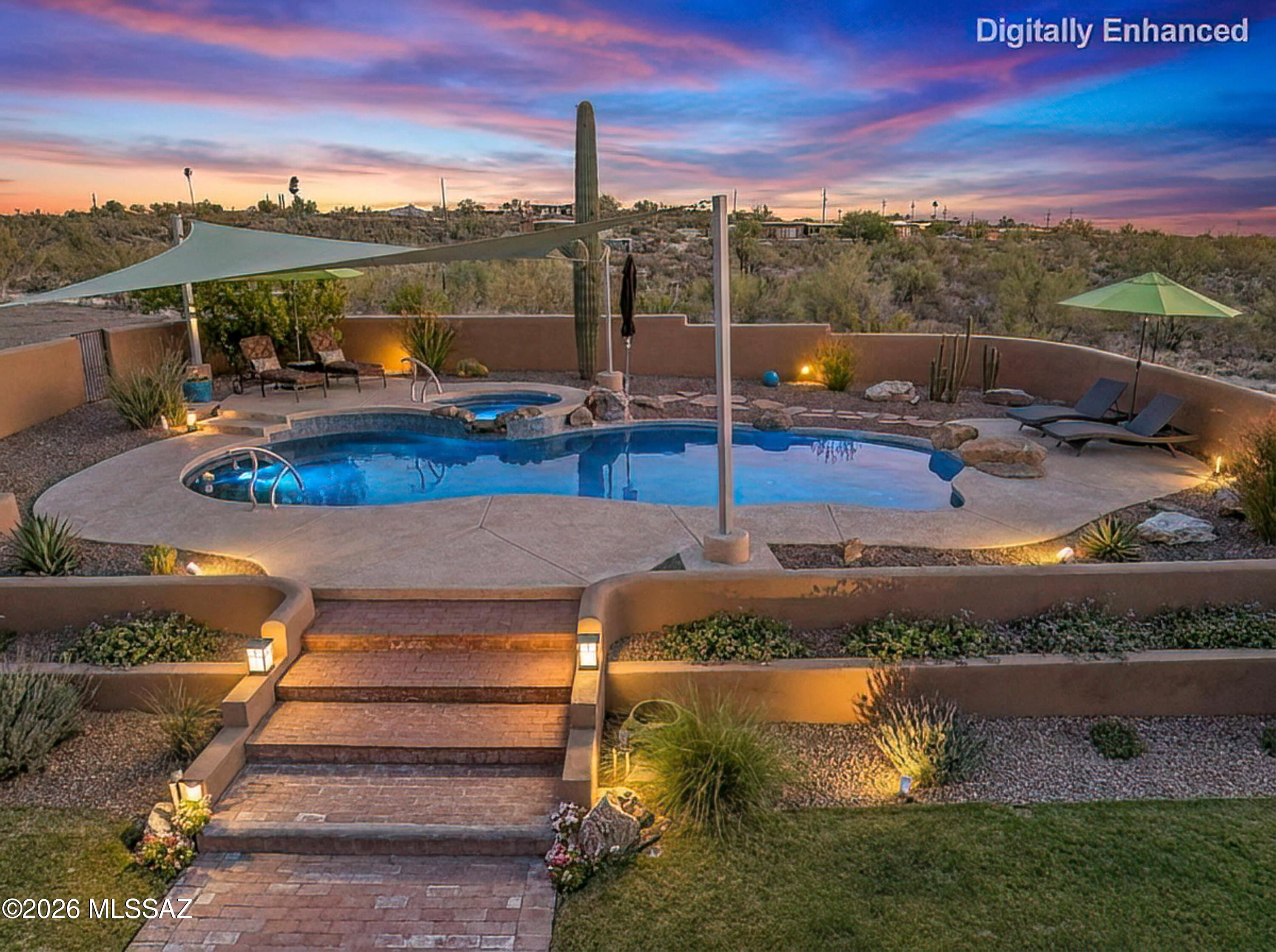11160 East Golf Links Road Tucson, AZ 85730 - Photo 33 of 51 Resort style pool area complete with an elevated spa, waterfall and sun sail.