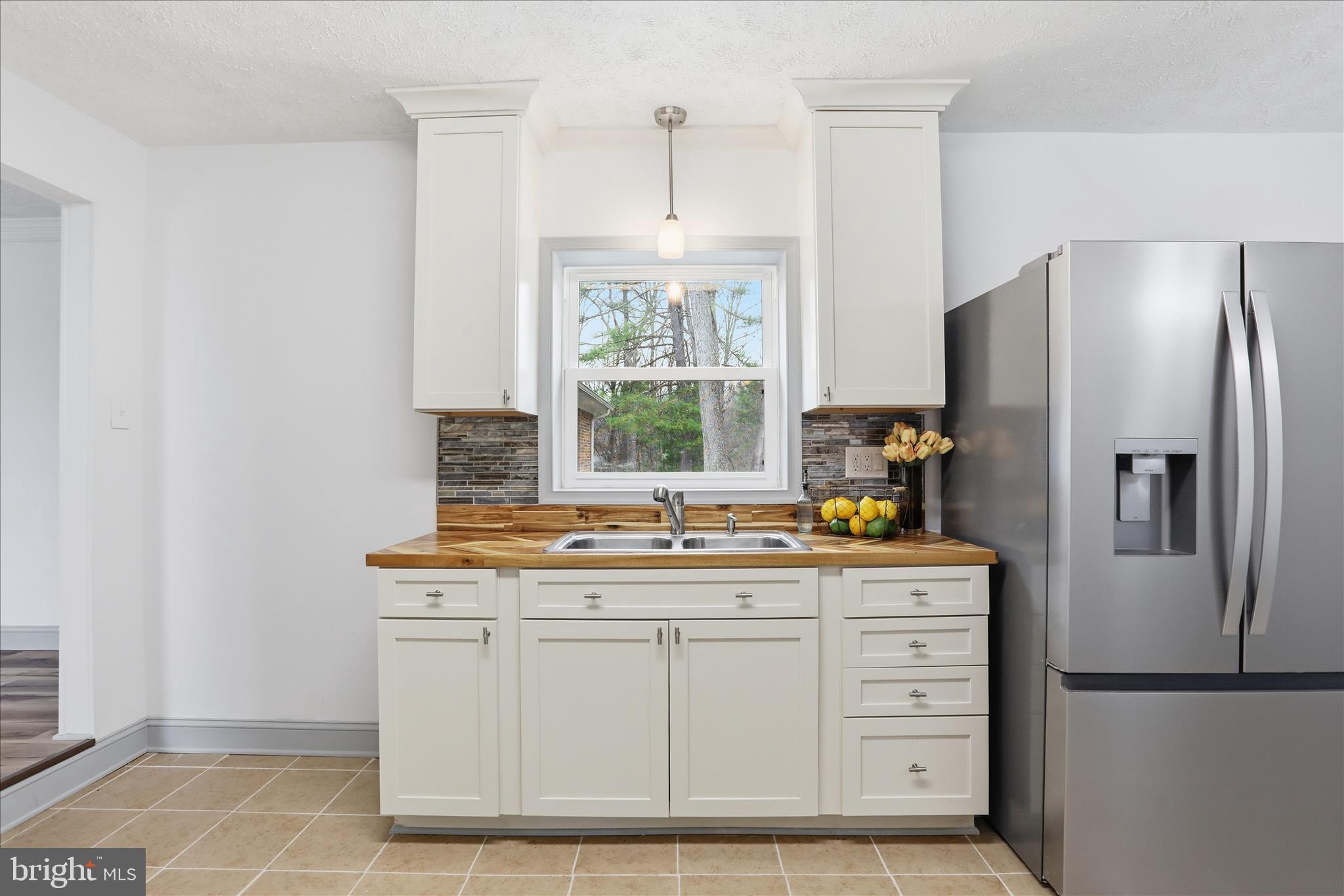 1310 Siler Road Winchester, VA 22603 - Photo 18 of 39 Sink with view of patio and backyard