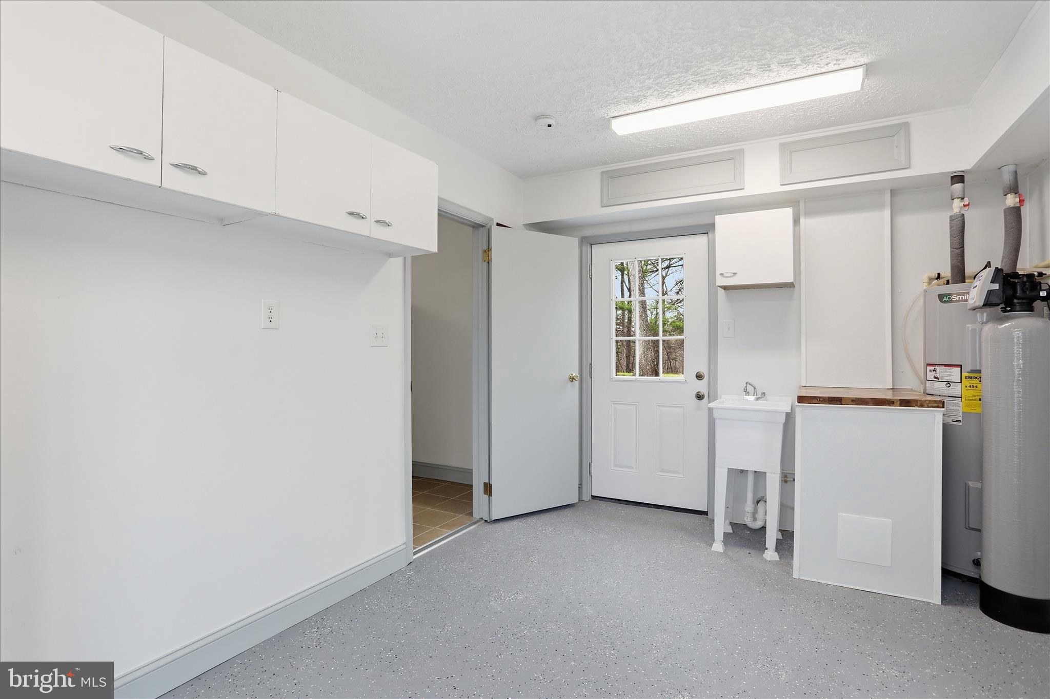 1310 Siler Road Winchester, VA 22603 - Photo 32 of 39 Utility room w/door to rear patio