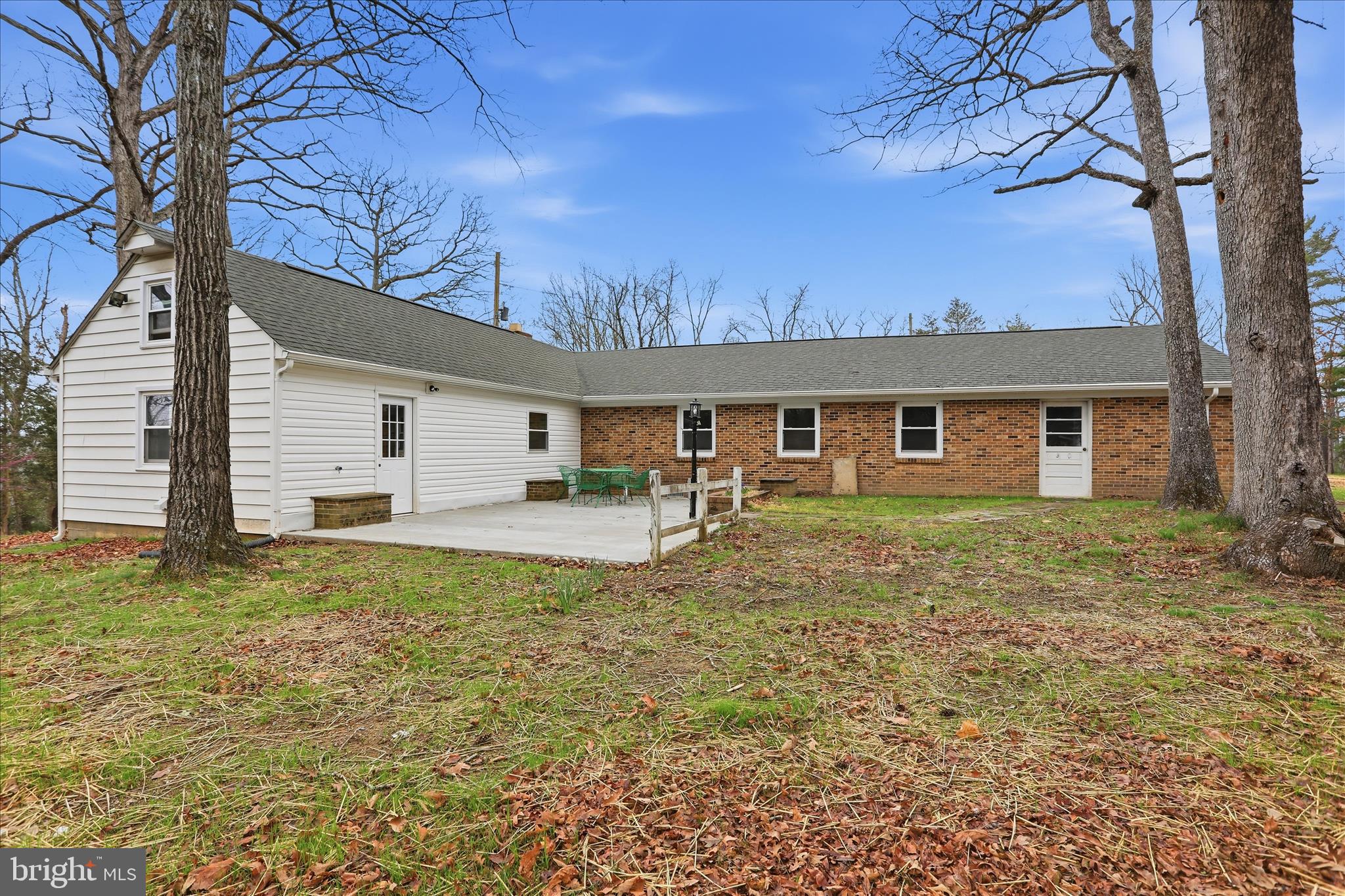 1310 Siler Road Winchester, VA 22603 - Photo 33 of 39 Patio w/door to utility room & rear garage door