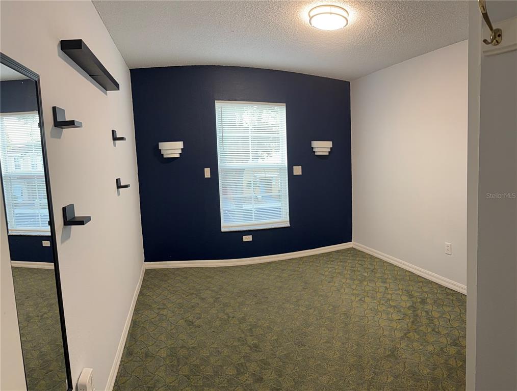 1090 Park Ridge Circle Kissimmee, FL 34746 - Photo 13 of 30 a view of an empty room with a window