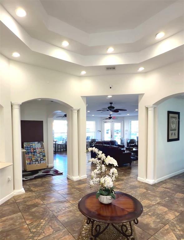1090 Park Ridge Circle Kissimmee, FL 34746 - Photo 16 of 30 a living room with furniture kitchen view and a table