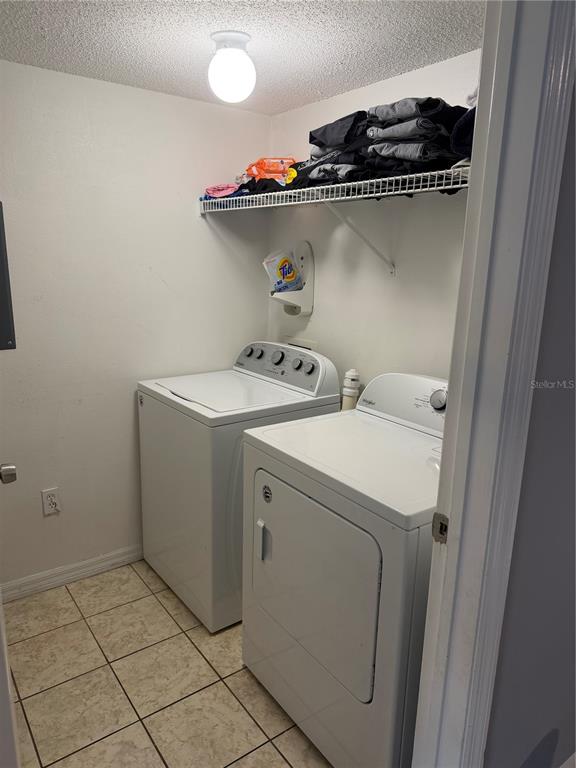 1090 Park Ridge Circle Kissimmee, FL 34746 - Photo 27 of 30 a utility room with dryer and washer