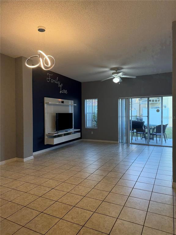 1090 Park Ridge Circle Kissimmee, FL 34746 - Photo 7 of 30 a view of an empty room with a fireplace