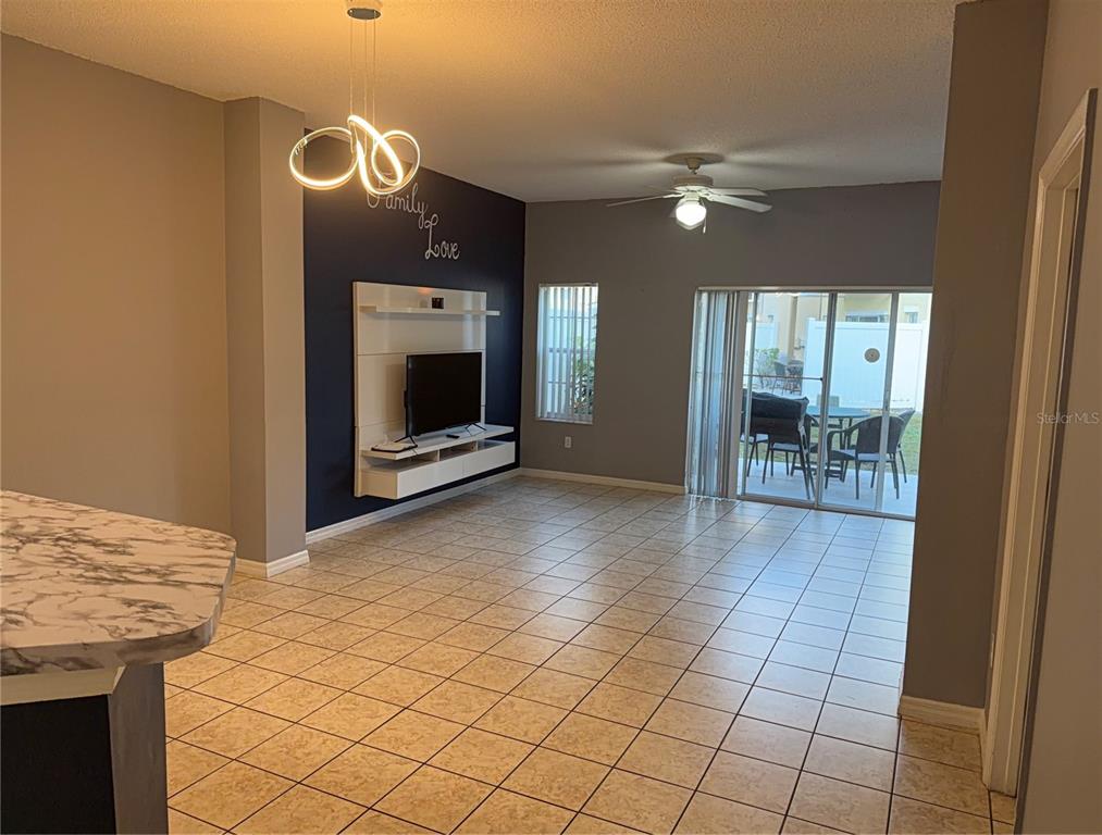 1090 Park Ridge Circle Kissimmee, FL 34746 - Photo 8 of 30 a view of a livingroom with furniture and front door