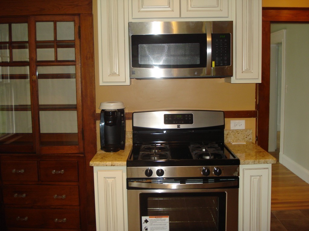 17 Willow Street Wellesley, MA 02481 - Photo 2 of 12 a stove top oven sitting inside of a kitchen