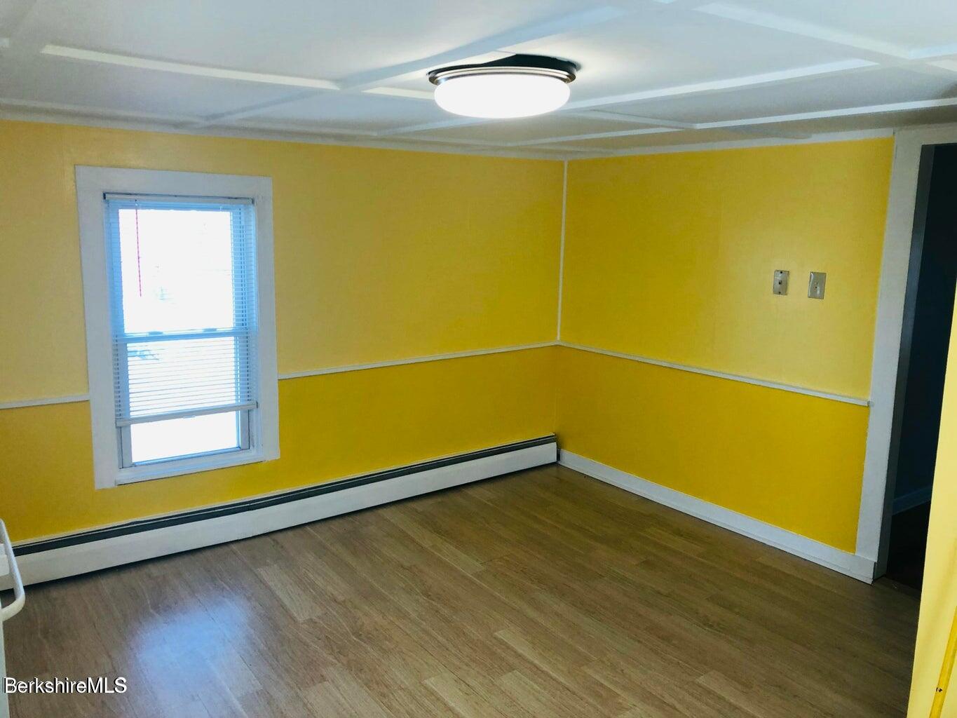 3-5 Pleasant Street Pittsfield, MA 01201 - Photo 19 of 22 a view of a room with wooden floor and a window