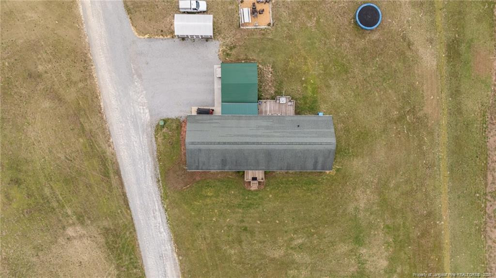 4194 Abattoir Road Angier, NC 27501 - Photo 13 of 50 a bathroom with a granite countertop sink
