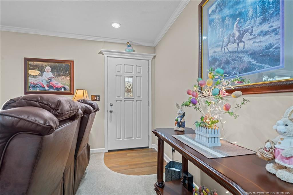4194 Abattoir Road Angier, NC 27501 - Photo 29 of 50 a bedroom with furniture and wooden floor