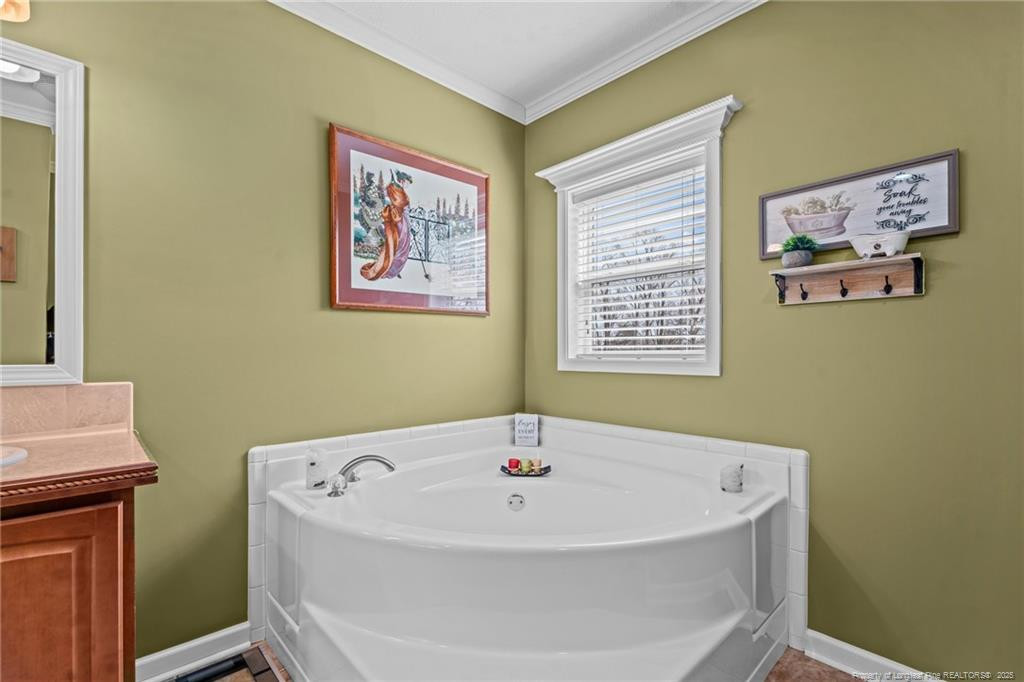 4194 Abattoir Road Angier, NC 27501 - Photo 37 of 50 a white bath tub sitting next to a window
