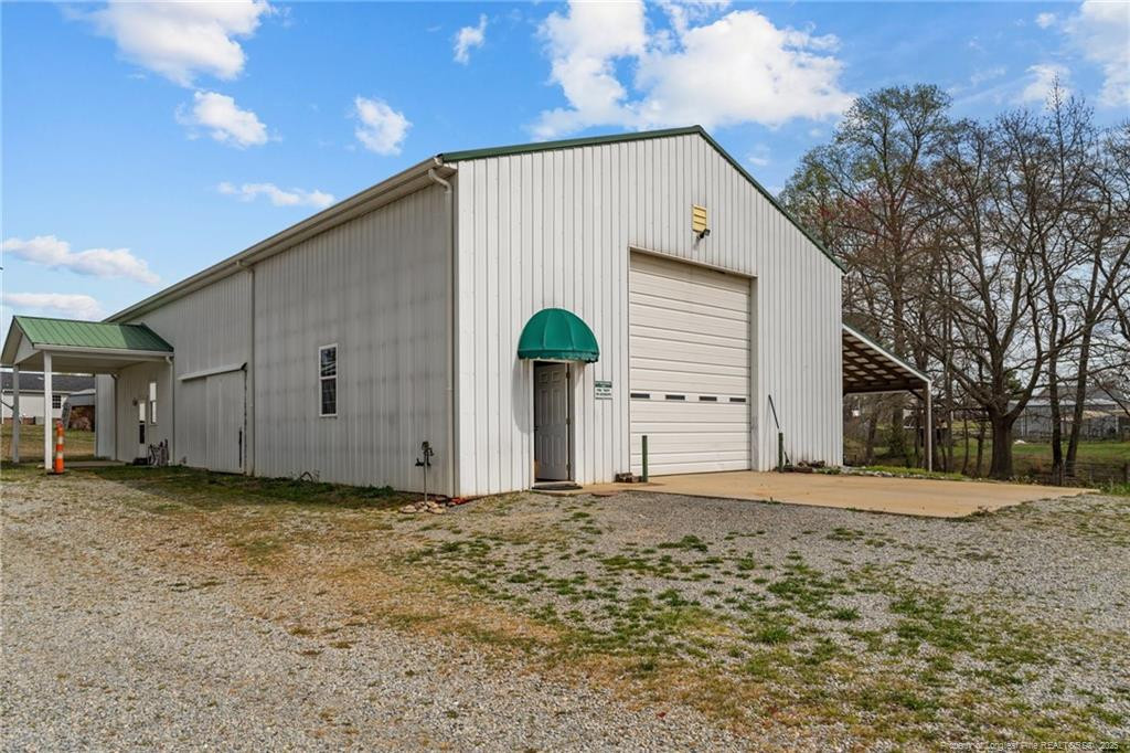 4194 Abattoir Road Angier, NC 27501 - Photo 39 of 50 a view of a house with a yard