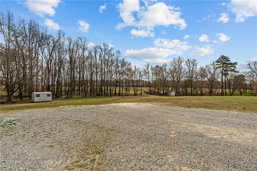 4194 Abattoir Road Angier, NC 27501 - Photo 45 of 50 a view of a playground with basketball court