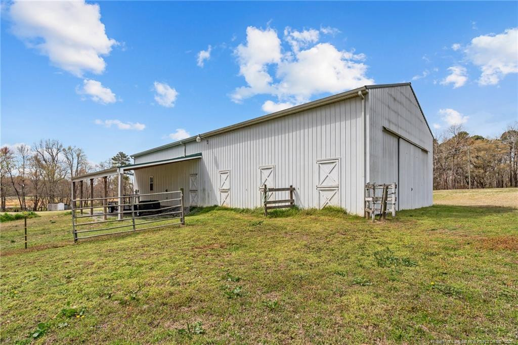 4194 Abattoir Road Angier, NC 27501 - Photo 47 of 50 a view of a house with a backyard