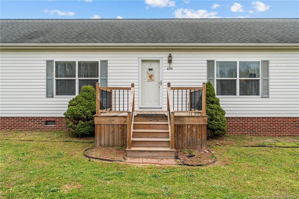 4194 Abattoir Road Angier, NC 27501 - Photo 6 of 50 a view of a back yard of the house