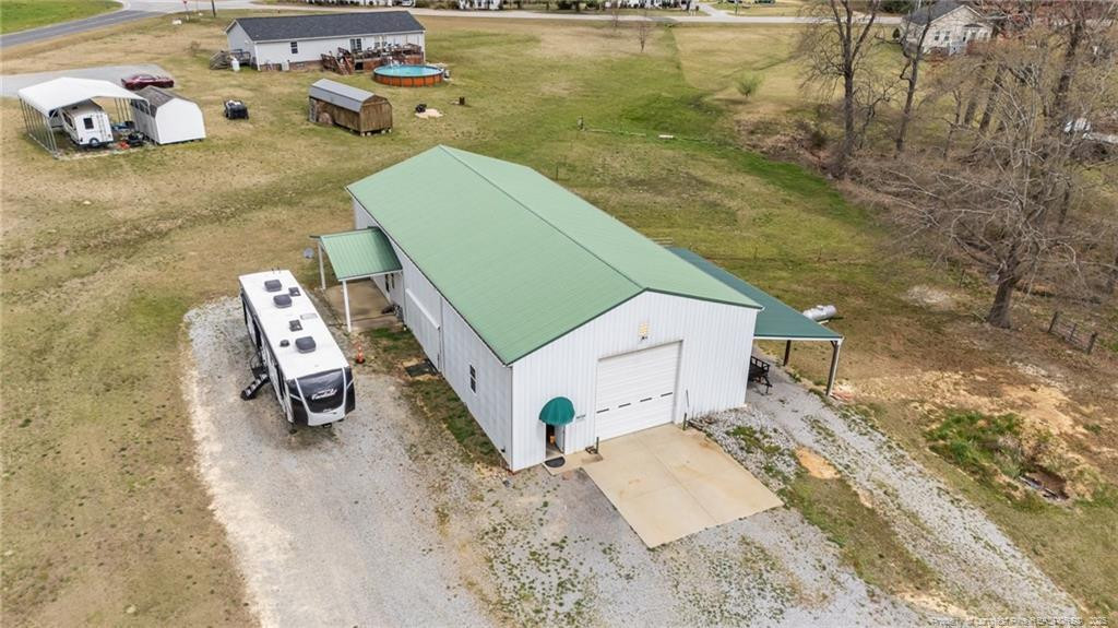4194 Abattoir Road Angier, NC 27501 - Photo 7 of 50 view of living room with furniture and floor to ceiling window