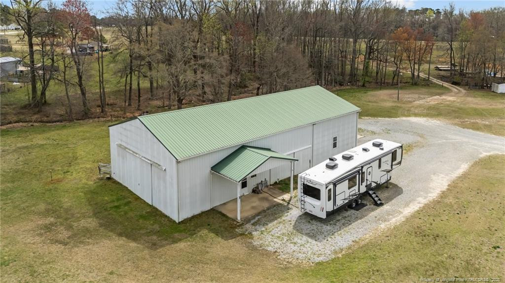 4194 Abattoir Road Angier, NC 27501 - Photo 8 of 50 a view of a patio with a table and chairs