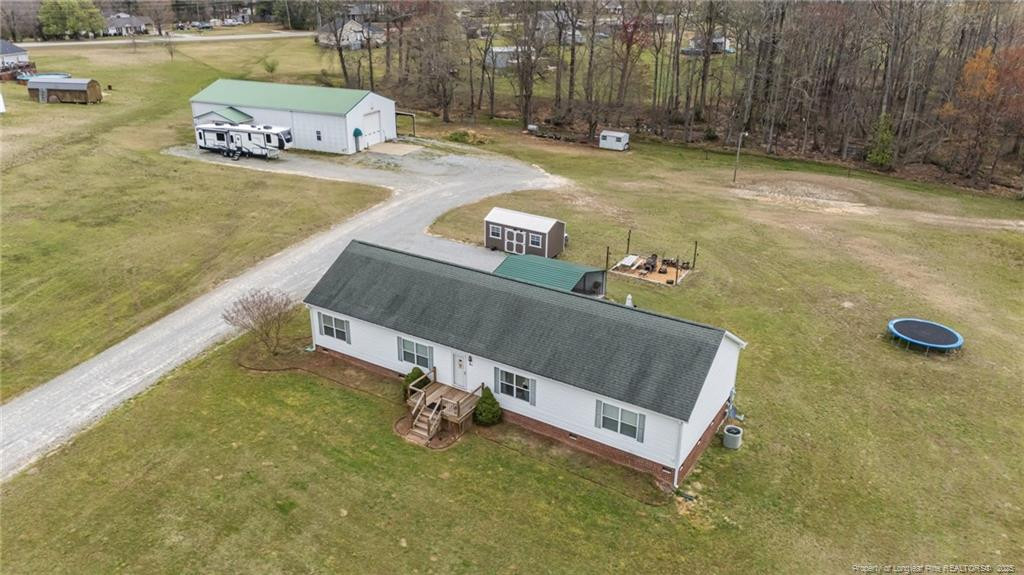 4194 Abattoir Road Angier, NC 27501 - Photo 10 of 50 a view of a two chairs in the patio