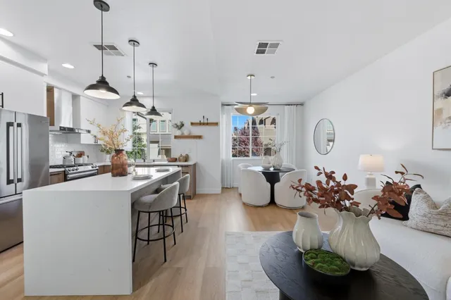 a very nice looking room with a large window and furniture