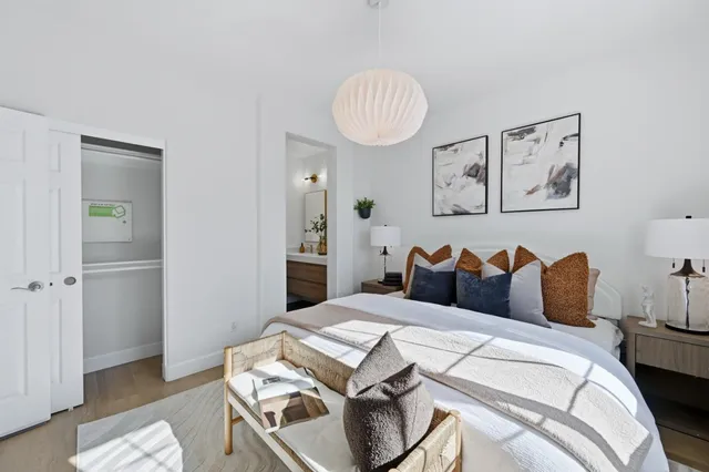 a bathroom with a sink mirror and toilet