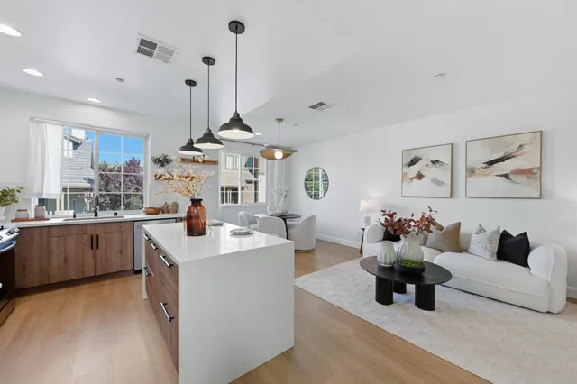 a kitchen with a stove and wooden cabinets