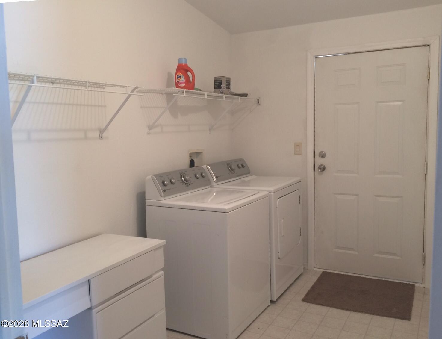 15146 North Ironwood Tree Road Tucson, AZ 85739 - Photo 9 of 9 a utility room with dryer and washer