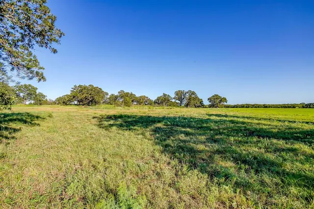 a view of a lake with a house in the background