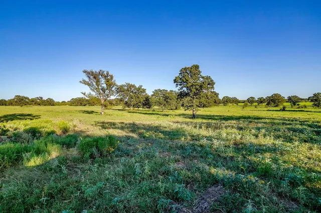 a view of a lake with a house in the background