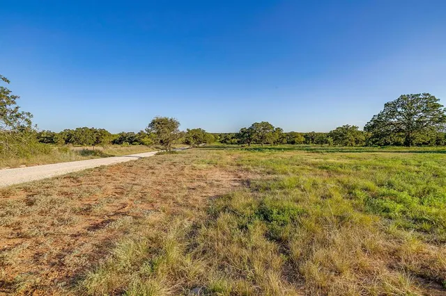 a view of a large body of water with a building in the background