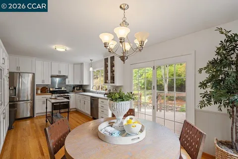 a kitchen with a table and chairs in it