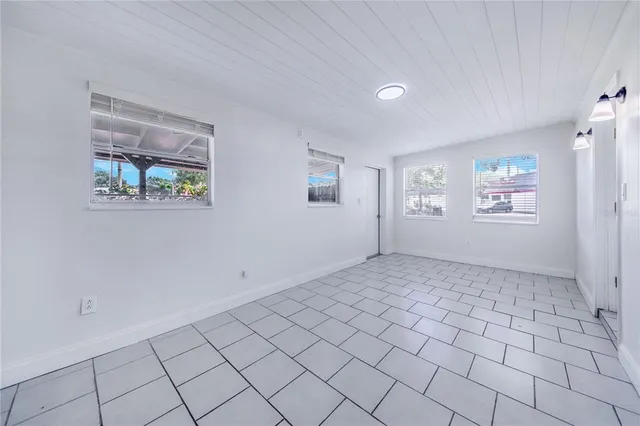 a view of an empty room and window