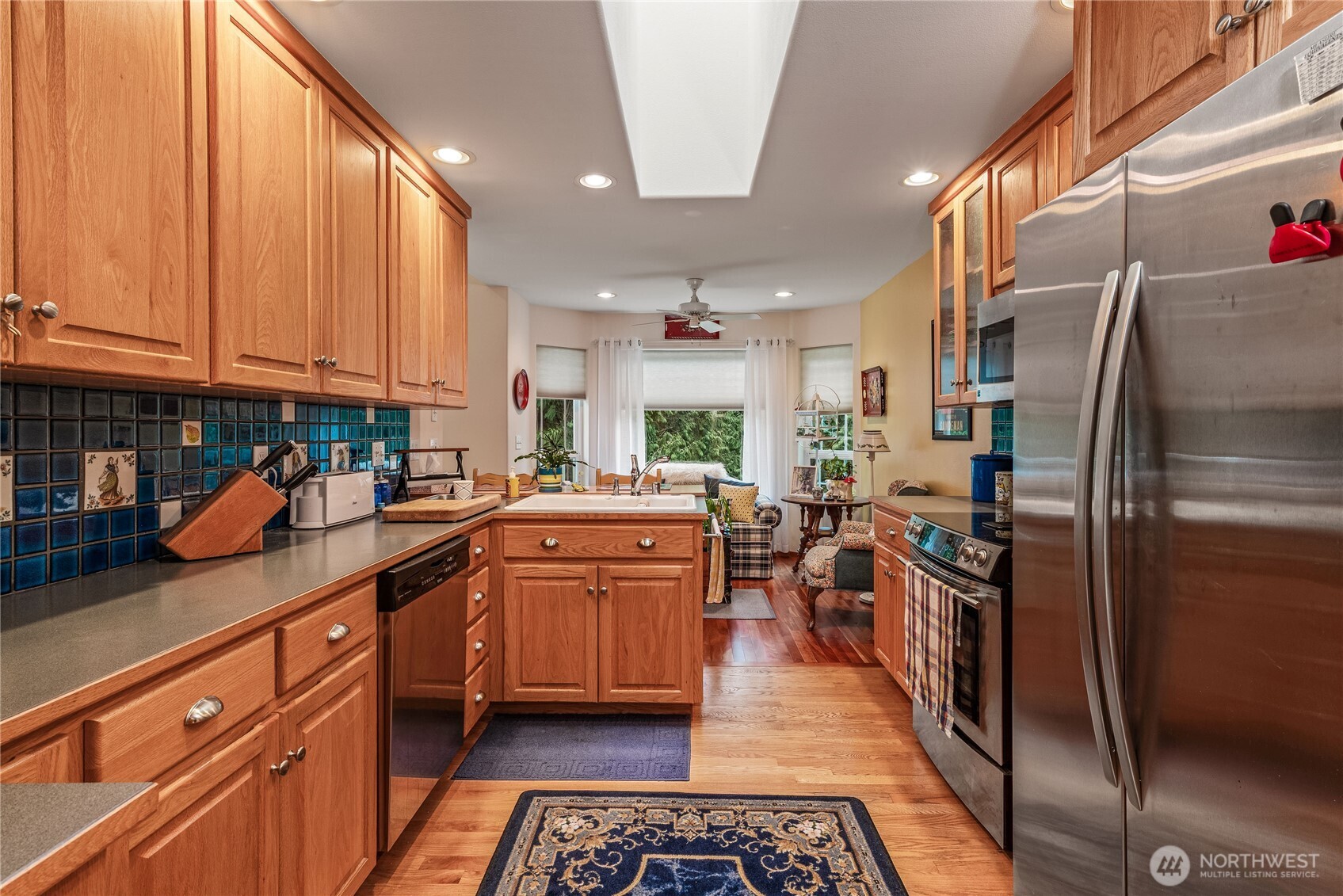 42 Nantucket Place Port Townsend, WA 98368 - Photo 11 of 33 a kitchen with stainless steel appliances granite countertop a refrigerator a stove and a sink