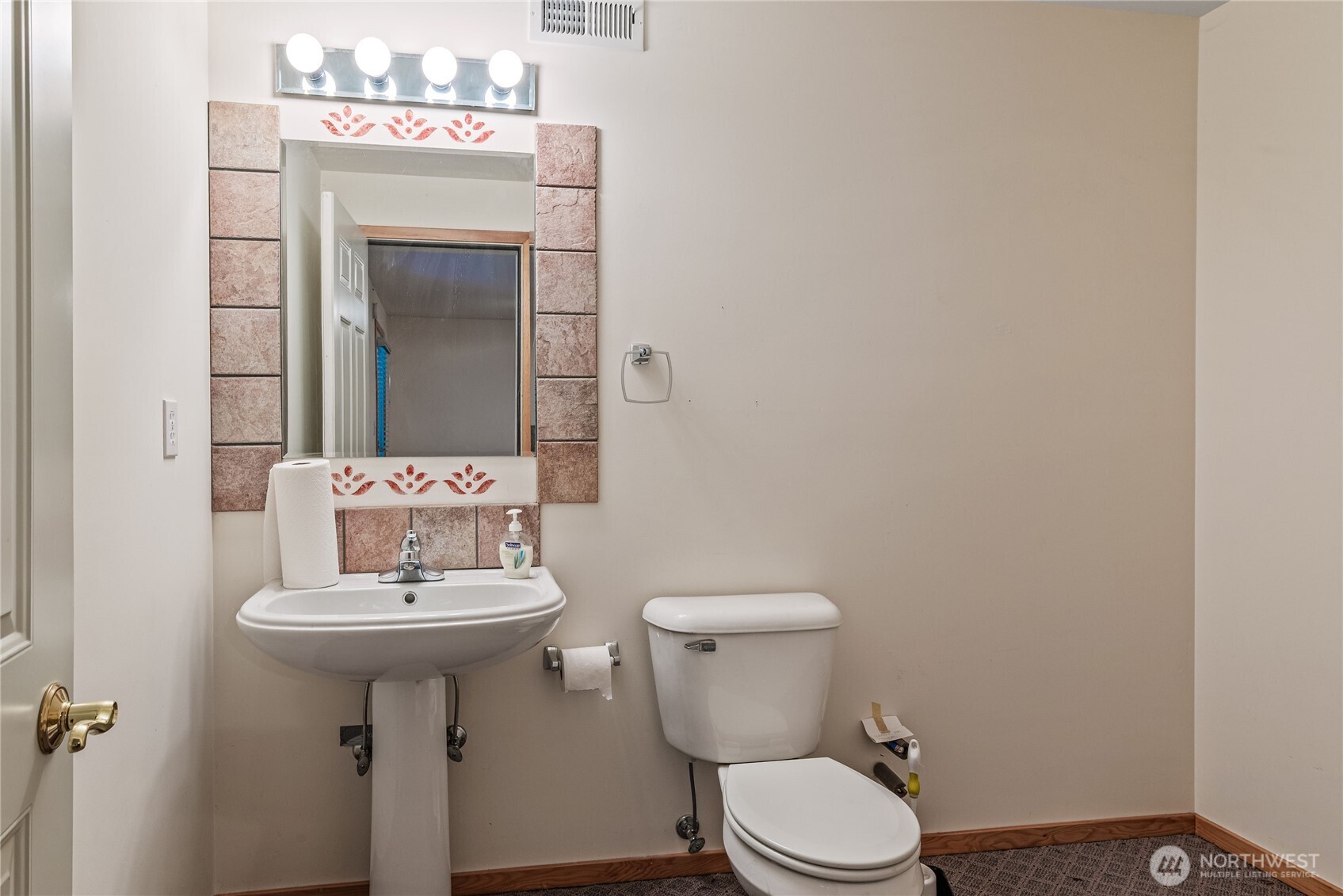 42 Nantucket Place Port Townsend, WA 98368 - Photo 33 of 33 a bathroom with a sink toilet and mirror