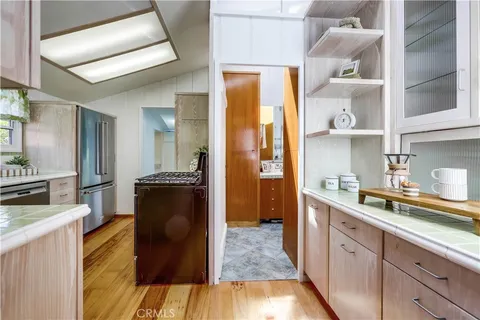 a kitchen with a sink and cabinets