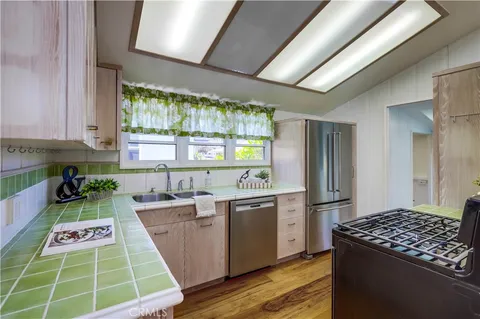 a kitchen with a stove and a sink
