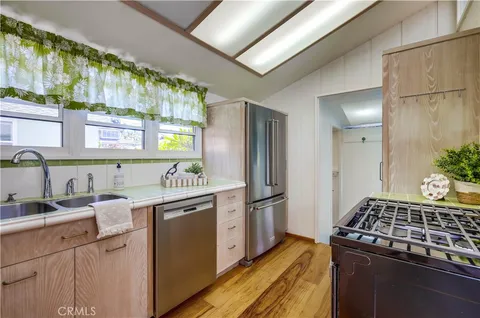 a bathroom with a sink mirror and toilet