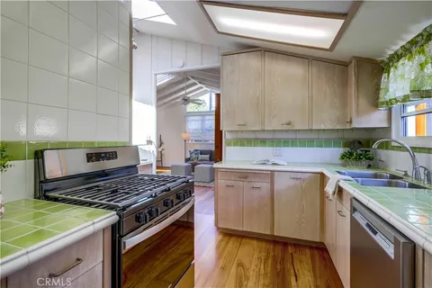 a spacious bedroom with a bed and a chandelier