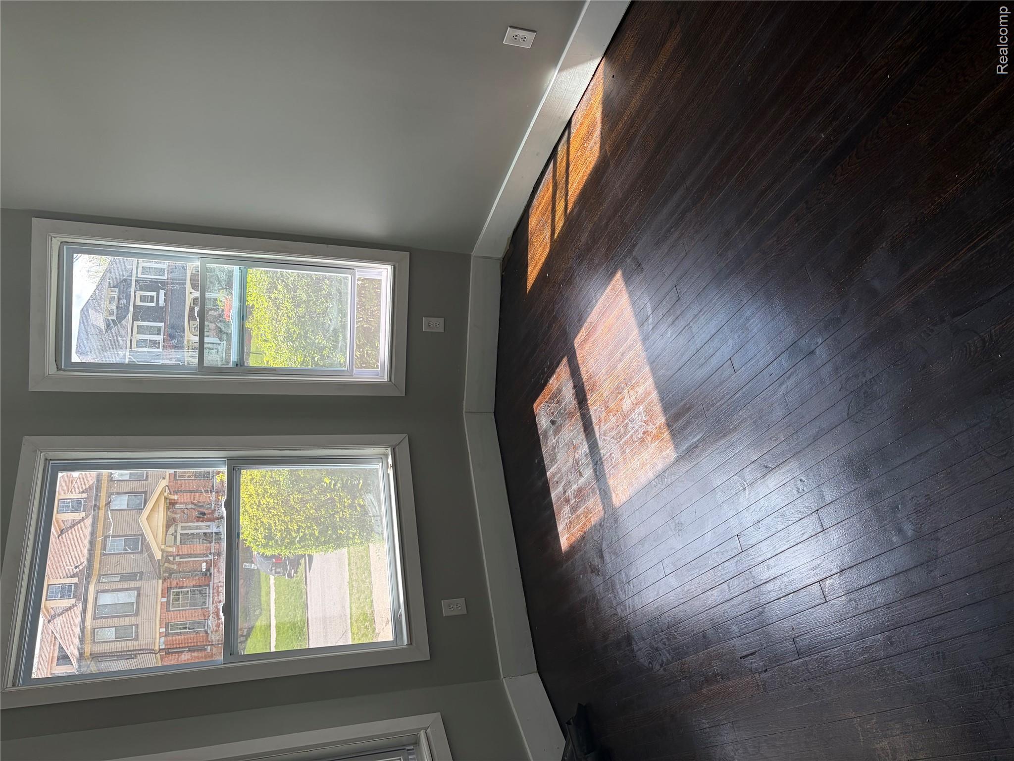 2420 Field Street Detroit, MI 48214 - Photo 3 of 15 Unfurnished room featuring dark wood-style floors