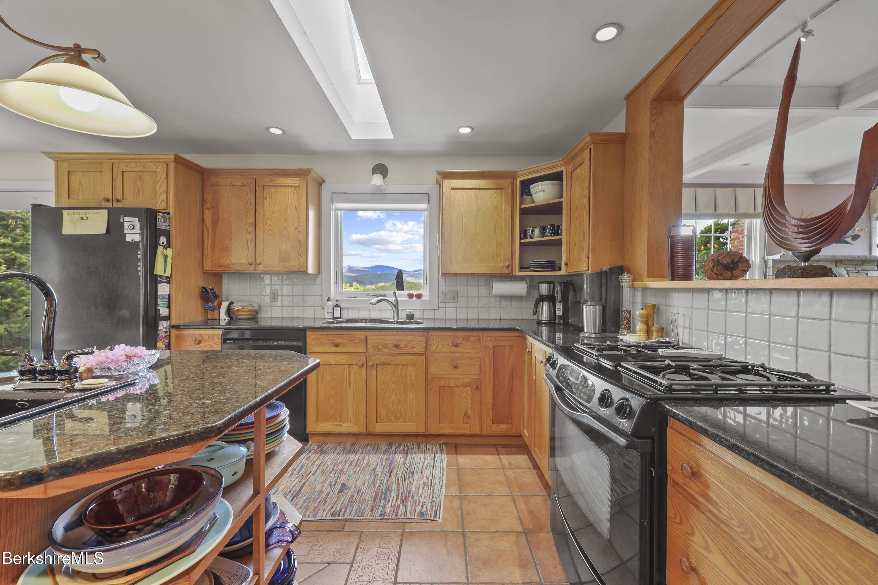 821 Pattison Road North Adams, MA 01247 - Photo 24 of 68 a kitchen with stainless steel appliances granite countertop a stove a sink and a microwave