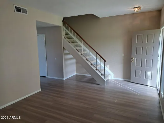 a view of entryway with wooden floor