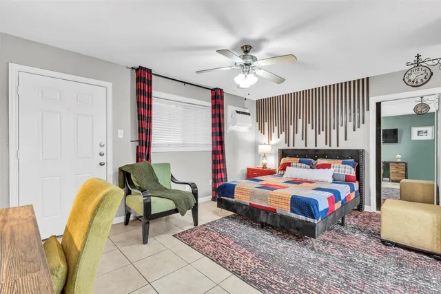 a bedroom with furniture and a chandelier