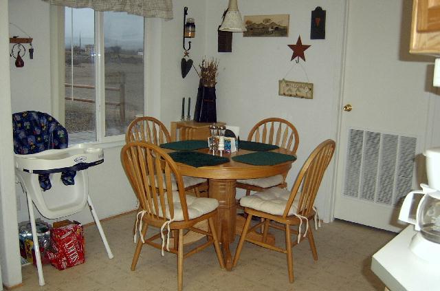 41 Blaine Road Granger, WA 98932 - Photo 8 of 9 a view of a dining room with furniture and wooden floor