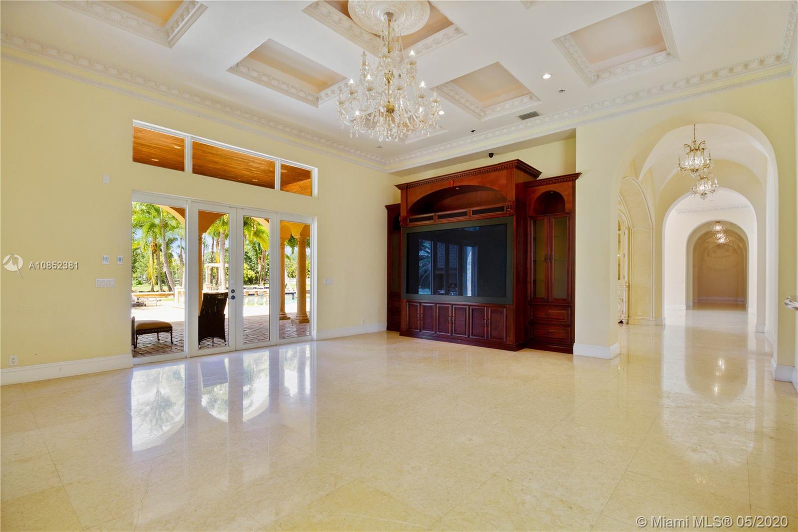14201 Stirling Road Southwest Ranches, FL 33330 - Photo 20 of 61 Living room with entrance to the patio and pool