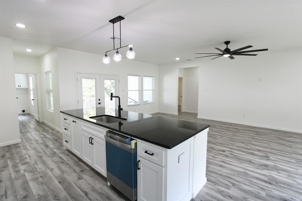 842 White Oak Drive Woodway, TX 76712 - Photo 12 of 12 a kitchen with a sink stove and refrigerator