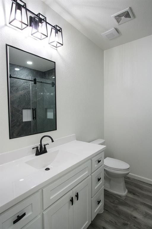 842 White Oak Drive Woodway, TX 76712 - Photo 8 of 12 a bathroom with a sink and a toilet