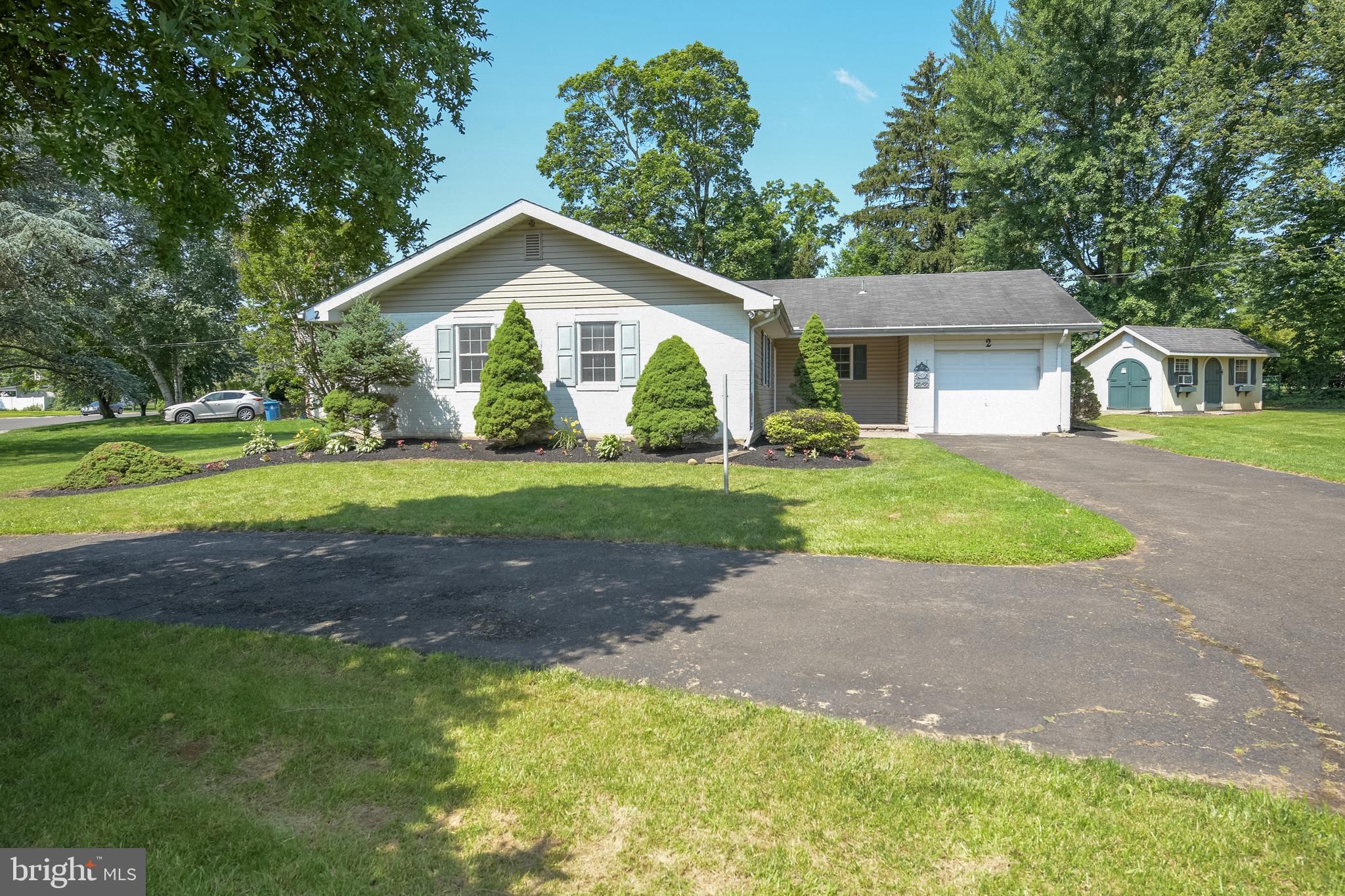 2 Broadale Road Doylestown, PA 18901 - Photo 14 of 56 a front view of a house with a yard and garage