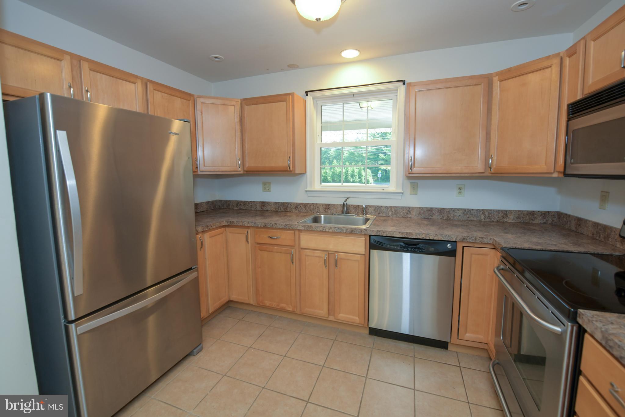 2 Broadale Road Doylestown, PA 18901 - Photo 22 of 56 a kitchen with stainless steel appliances granite countertop a refrigerator sink and microwave