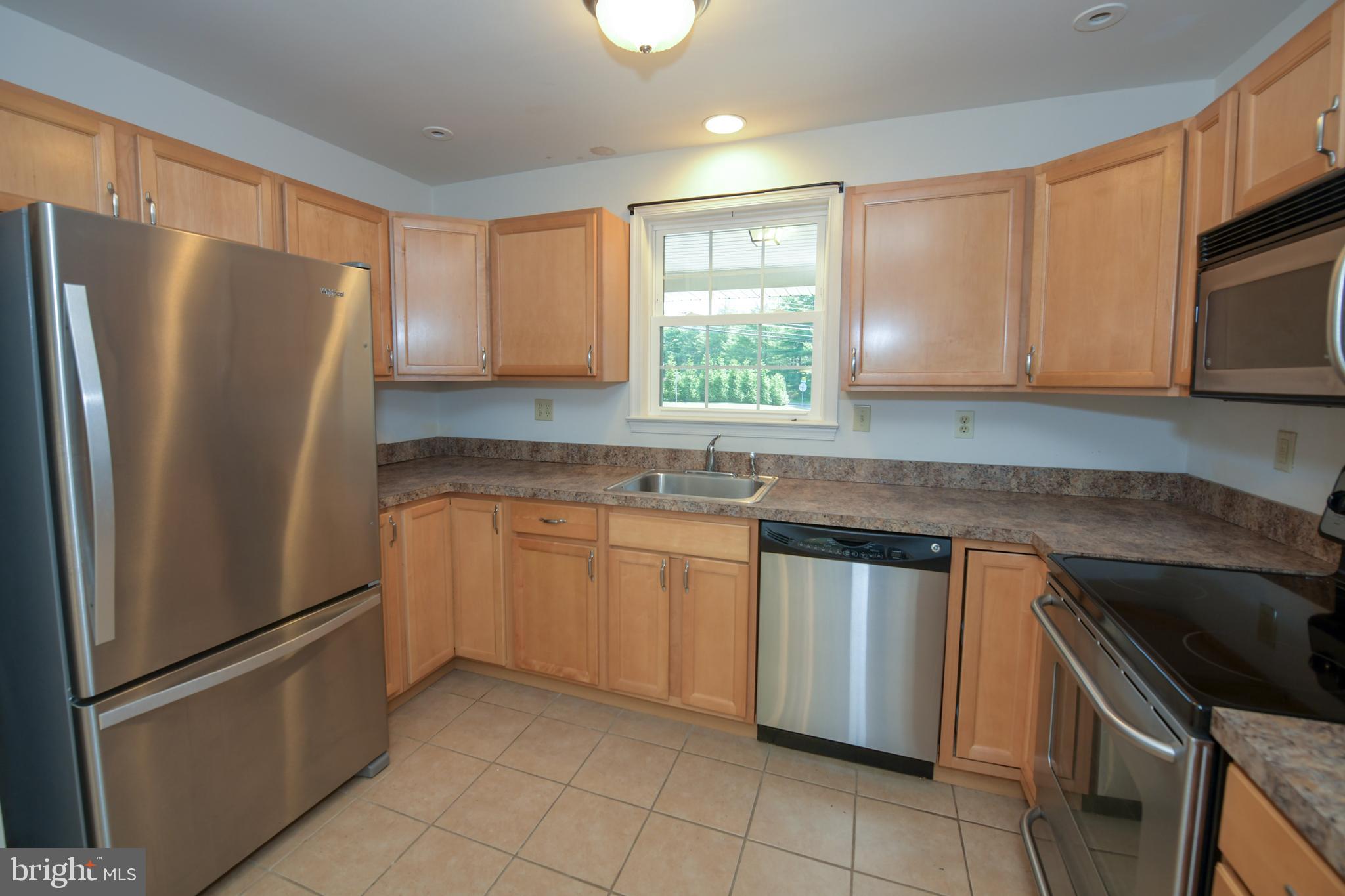2 Broadale Road Doylestown, PA 18901 - Photo 23 of 56 a kitchen with stainless steel appliances granite countertop a refrigerator sink and microwave