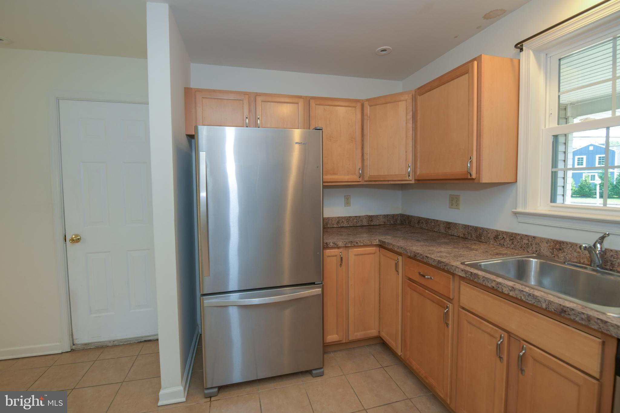 2 Broadale Road Doylestown, PA 18901 - Photo 24 of 56 a kitchen with stainless steel appliances granite countertop a refrigerator and a sink